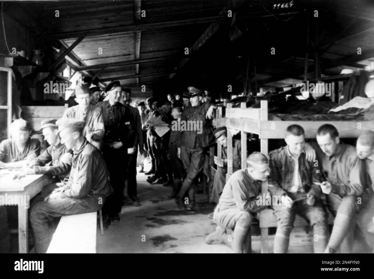 American prisoners of war are shown in a barracks during World War I ...