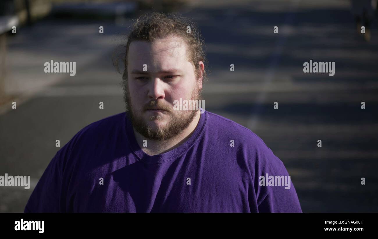 One overweight man preoccupied expression hi-res stock photography and ...
