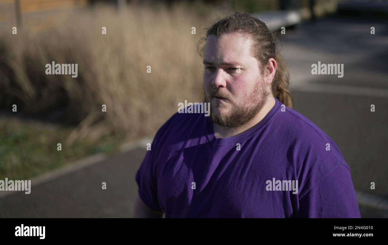 One overweight man preoccupied expression hi-res stock photography and ...