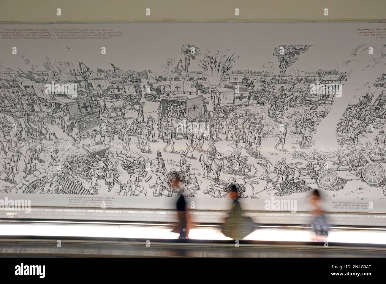 Commuters walk on a moving walkway in Montparnasse subway station front