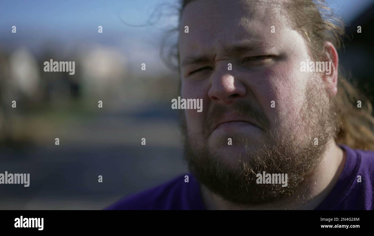 Man with disgust emotion close up face. Portrait of a person with