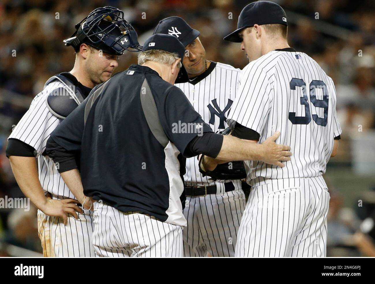 From left, New York Yankees catcher Brian McCann, Yankees pitching