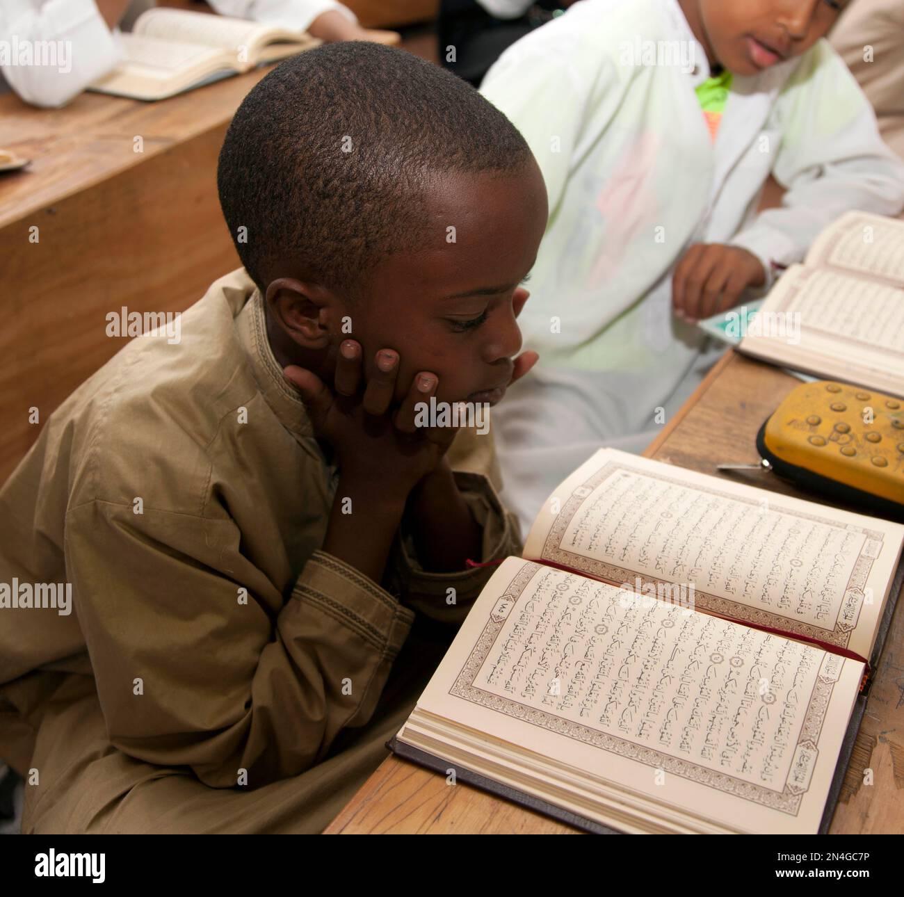 A child recites the Quran at the start of Muslim holy month of Ramadan