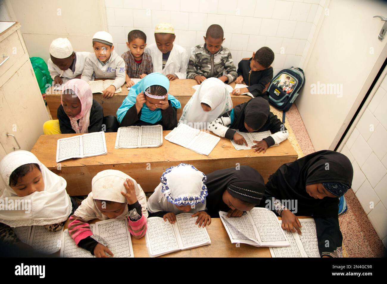 Children recite the Quran at the start of Muslim holy month of Ramadan