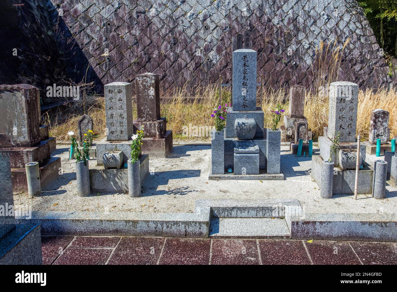 26032015 Kyoto, Japan. A small cemetery (graves) with flowers next to the Saihoji temple