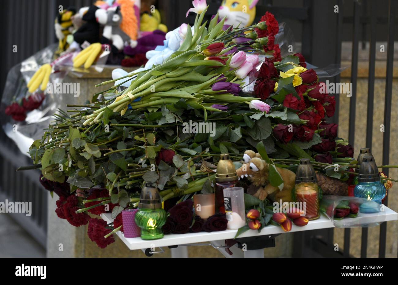 KYIV, UKRAINE FEBRUARY 8, 2023 Flowers, toys and vigil lanterns