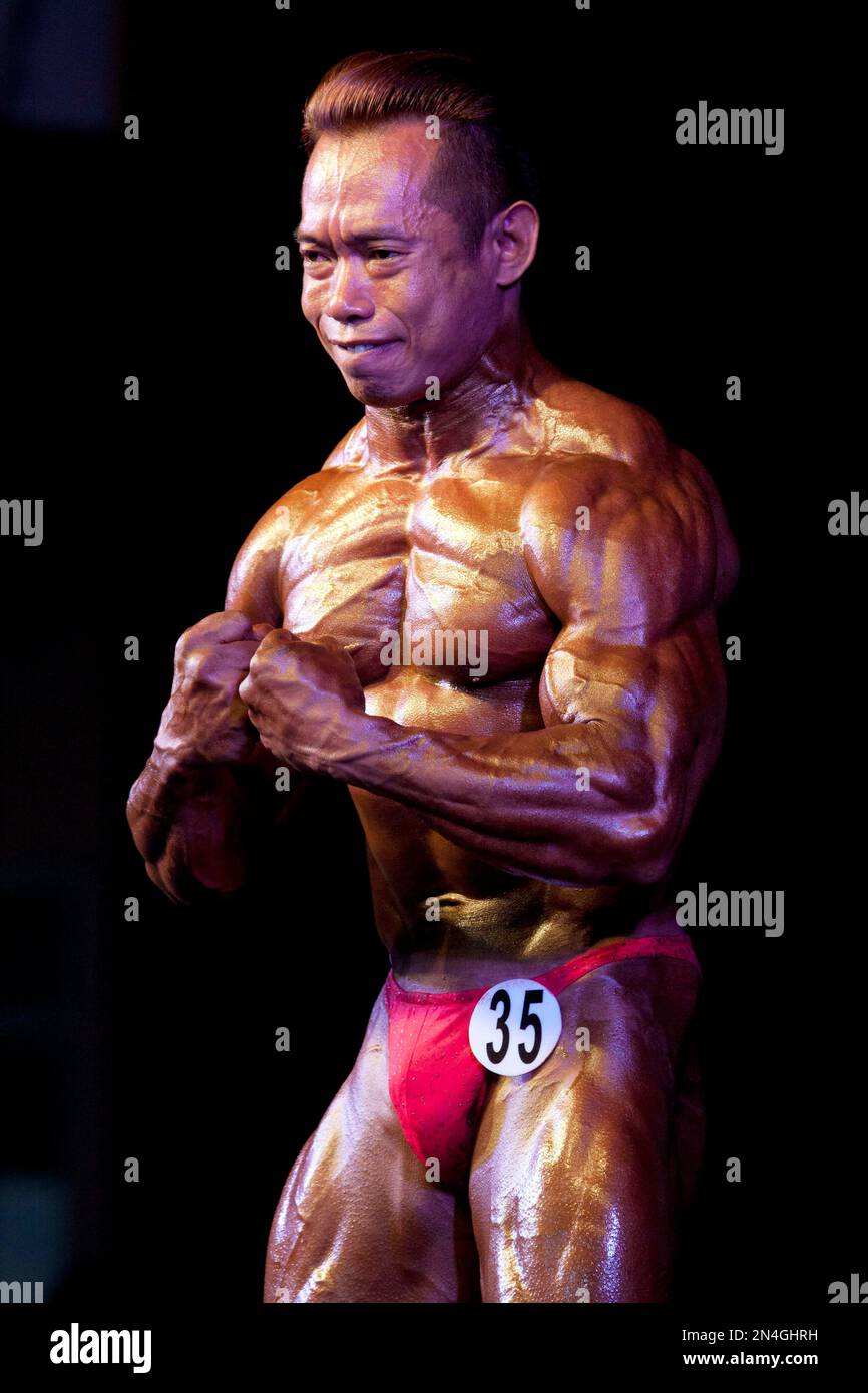 A Bodybuilder Poses During A Contest At Myanmar Convention Centre Saturday June 28 2014 In