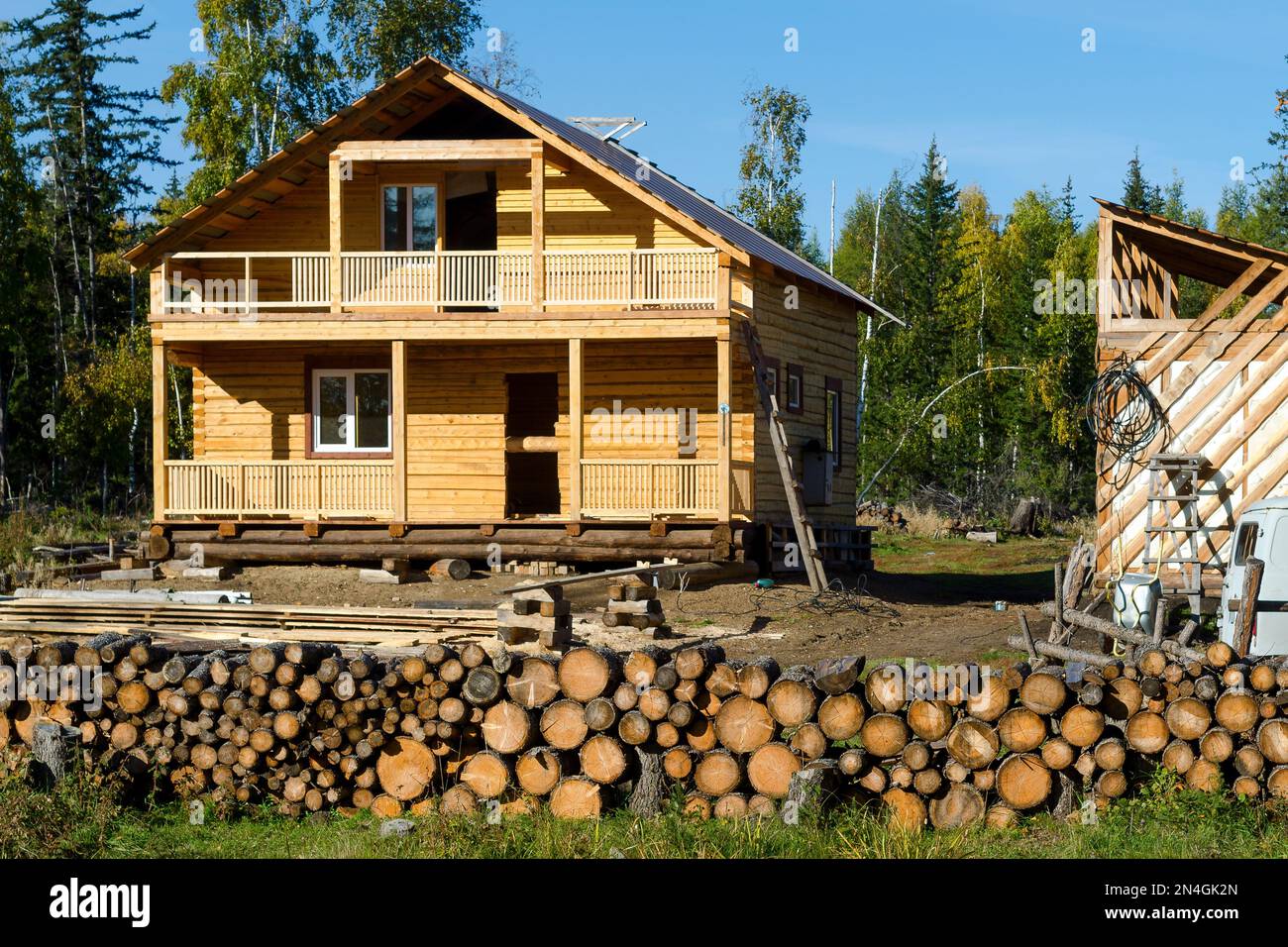 A new private residential building made of yellow pine logs stands