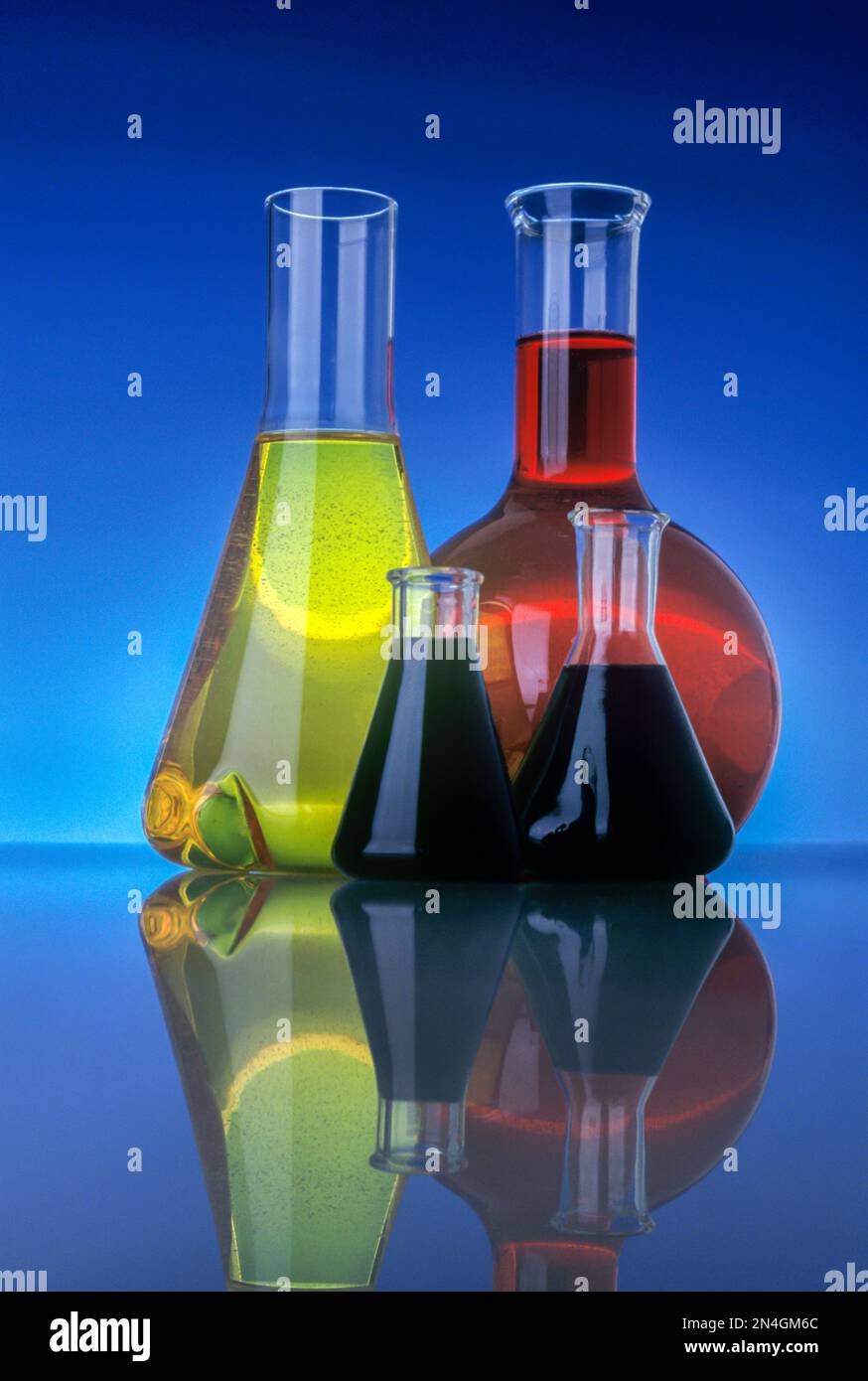 LABORATORY CHEMICAL FLASKS WITH COLORED LIQUIDS Stock Photo