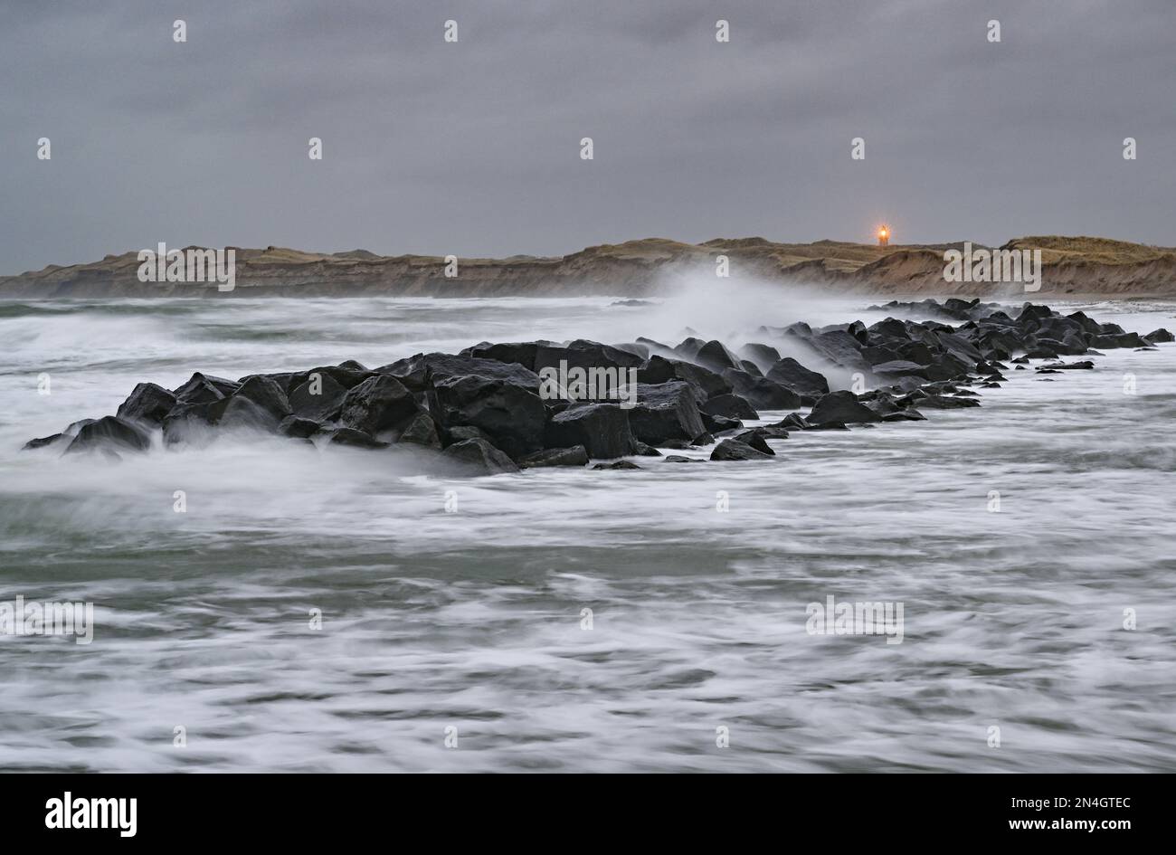 Agger, Denmark. 29th Jan, 2023. Waves of the North Sea on the west coast at the National Park Thy with the lighthouse Lodbjerg (shot with long exposure). The national park stretches from Agger Tange in the south to Hanstholm in the north. Credit: Patrick Pleul/dpa/Alamy Live News Stock Photo