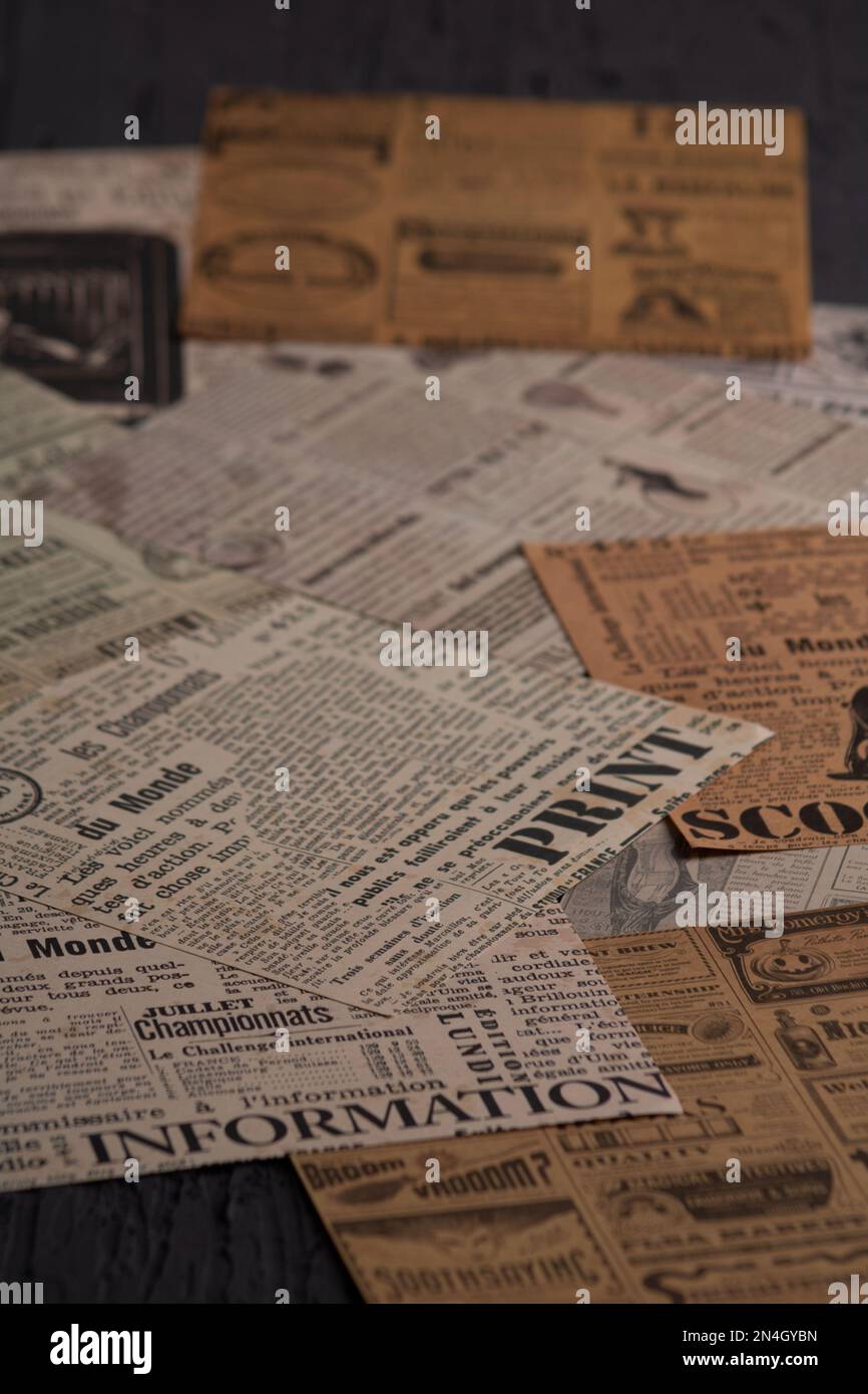 photo background lots of newspaper and magazine clippings lying on top of each other Stock Photo