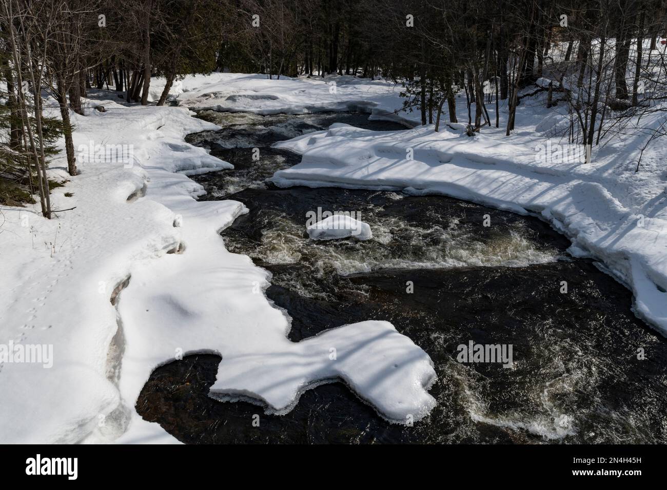 West River flowing in Winter, BrownsburgChatham, Quebec, Canada Stock