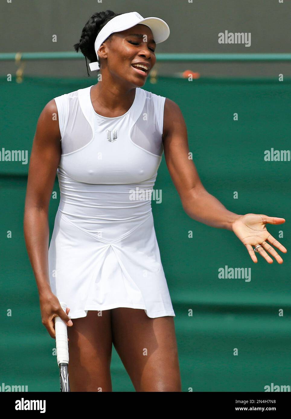 Venus Williams of U.S. gestures to Kurumi Nara of Japan during their