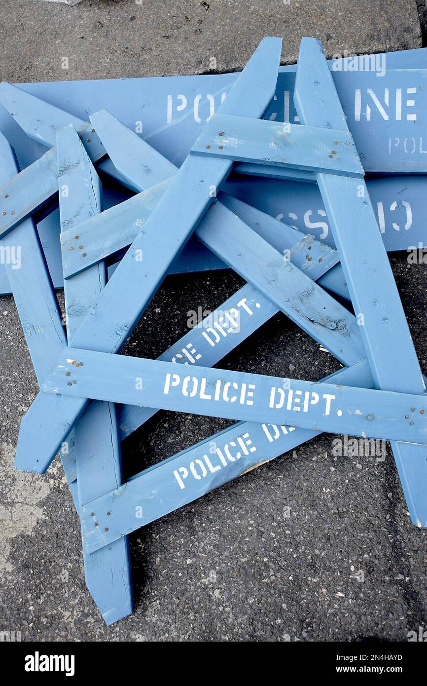 Blue New York City police department barricade parts dumped in road after an event. Stock Photo
