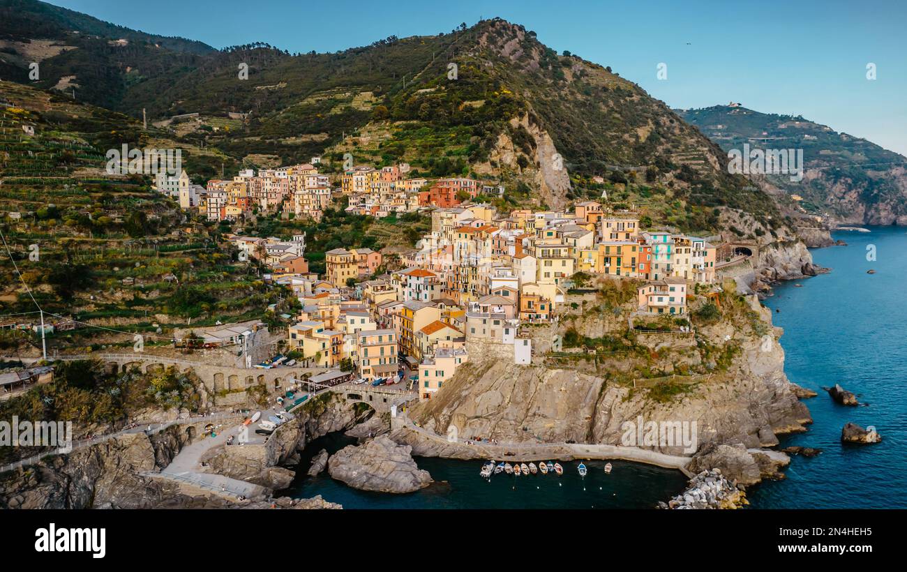 Aerial view of Corniglia and coastline of Cinque Terre,Italy.UNESCO Heritage Site.Picturesque colorful village on rock above sea.Summer holiday,travel Stock Photo