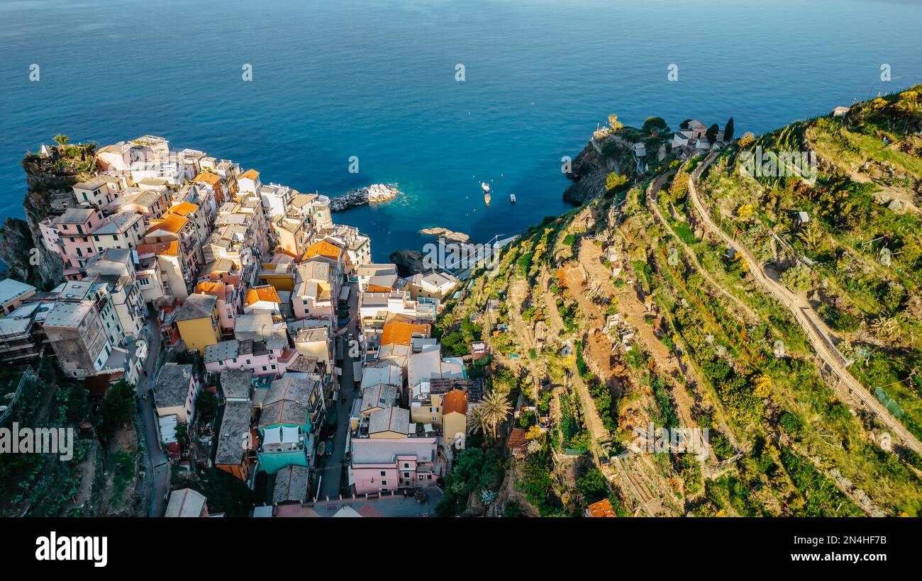 Aerial view of Manarola,Cinque Terre,Italy.UNESCO Heritage Site.Picturesque colorful village on rock above sea.Summer holiday,travel background.Italia Stock Photo