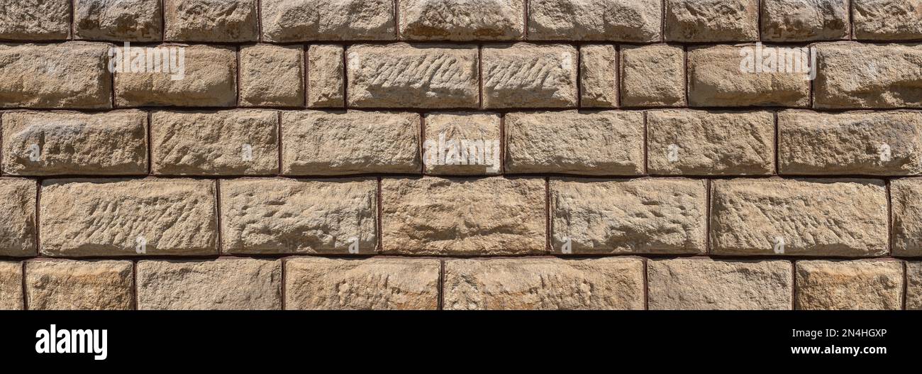 Brown sandstone panoramic wall with a very rough surface Stock Photo