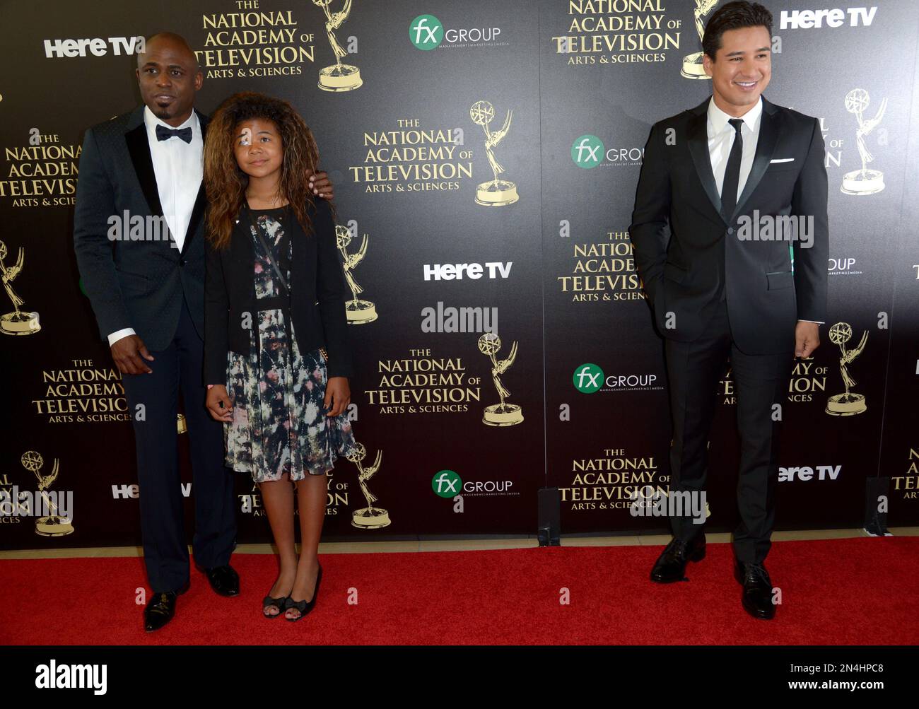 Mario Lopez, right, and from left, Wayne Brady and Maile Masako Brady