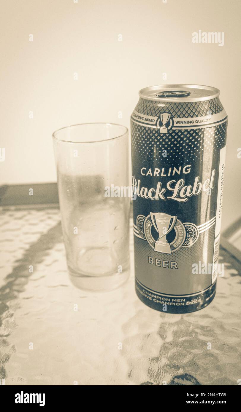 Carling Black Label beer can and glass on white background in Cape Town