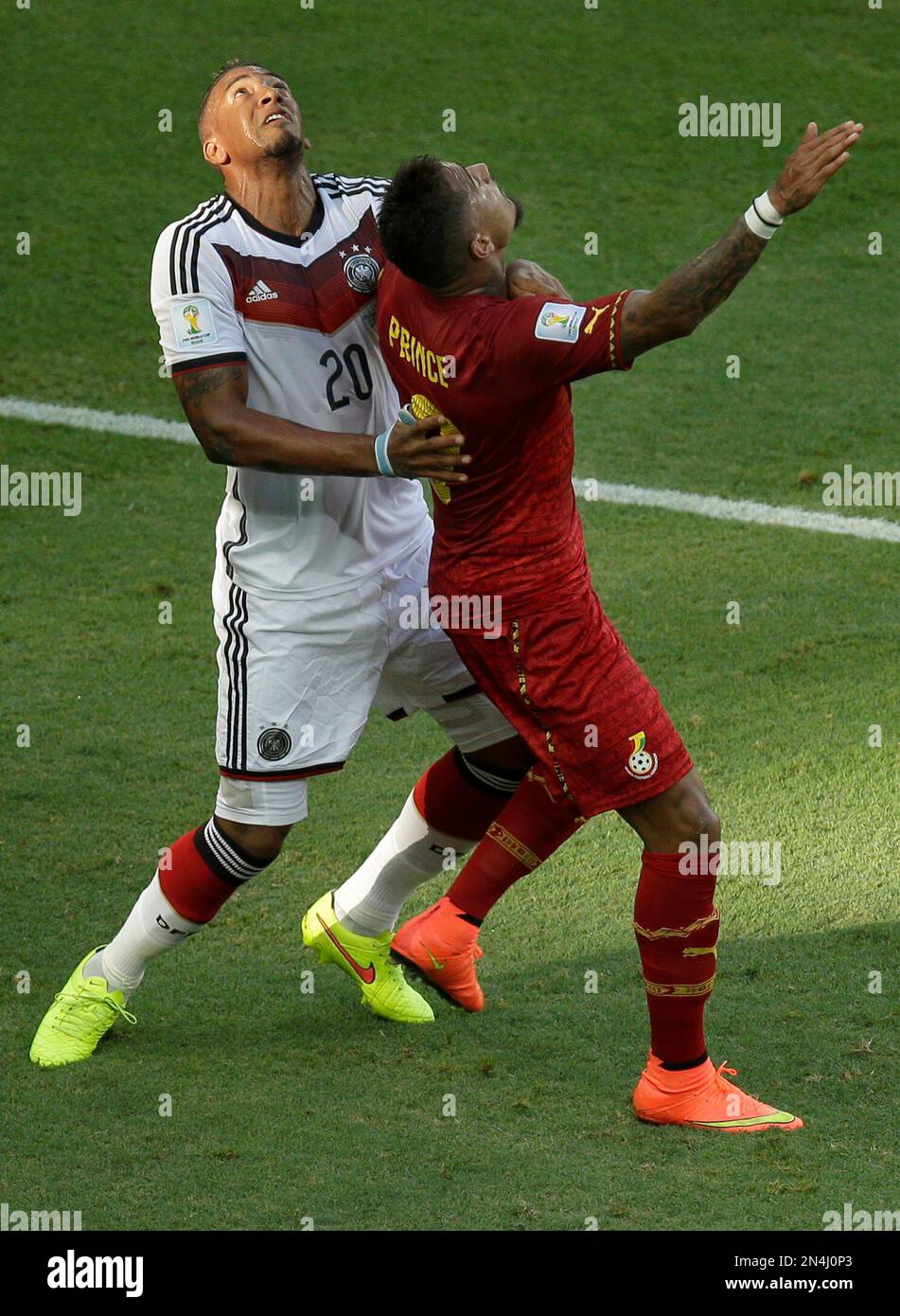 Germany's Jerome Boateng, left, and his half-borther Ghana's Kevin-Prince Boateng look up to the ball during the group G World Cup soccer match between Germany and Ghana at the Arena Castelao in Fortaleza, Brazil, Saturday, June 21, 2014. (AP Photo/Themba Hadebe) Stock Photo