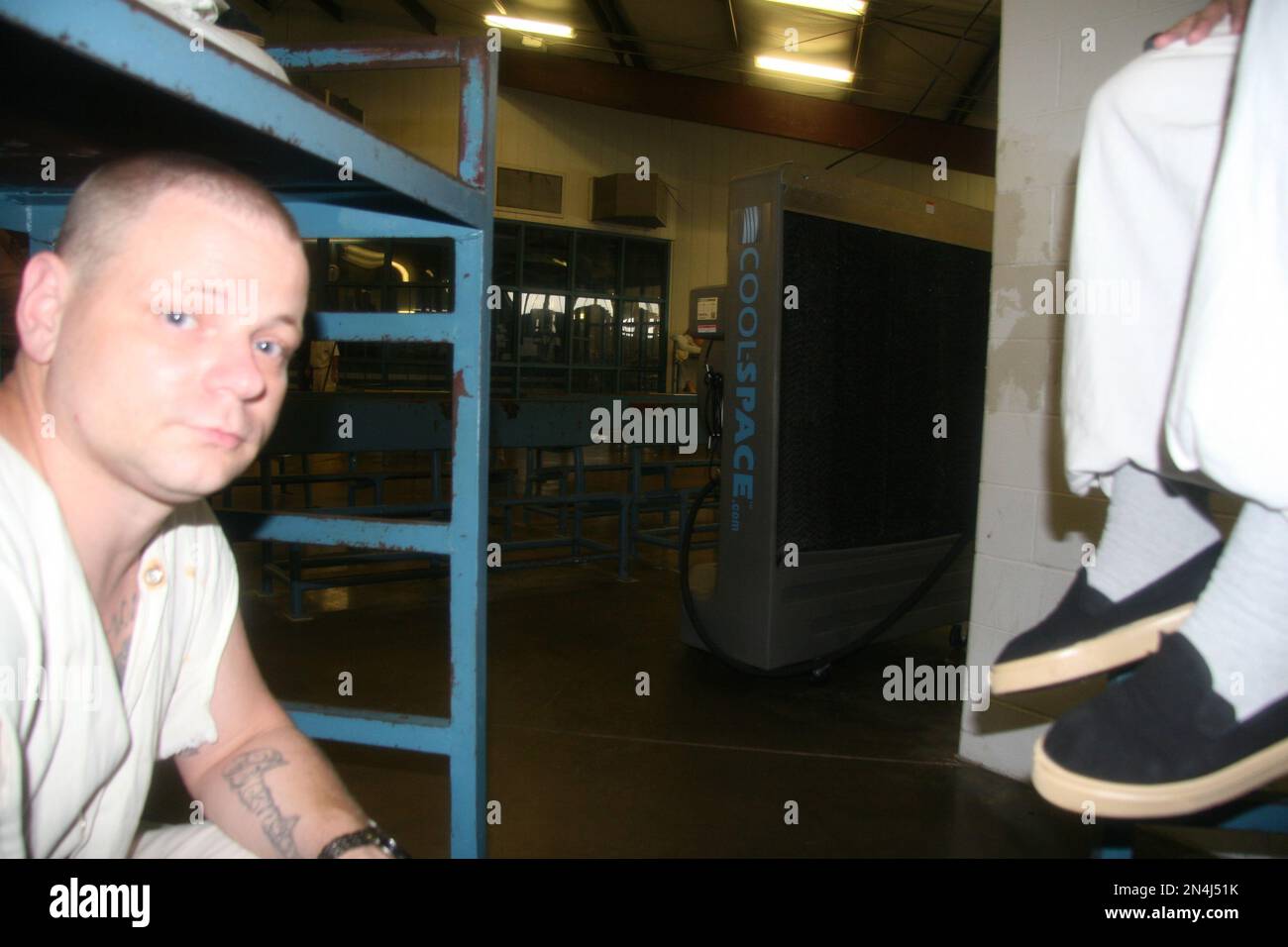 Inmate Doug Gore, 35, of Silsbee, Texas, sits on his bunk Friday, June ...