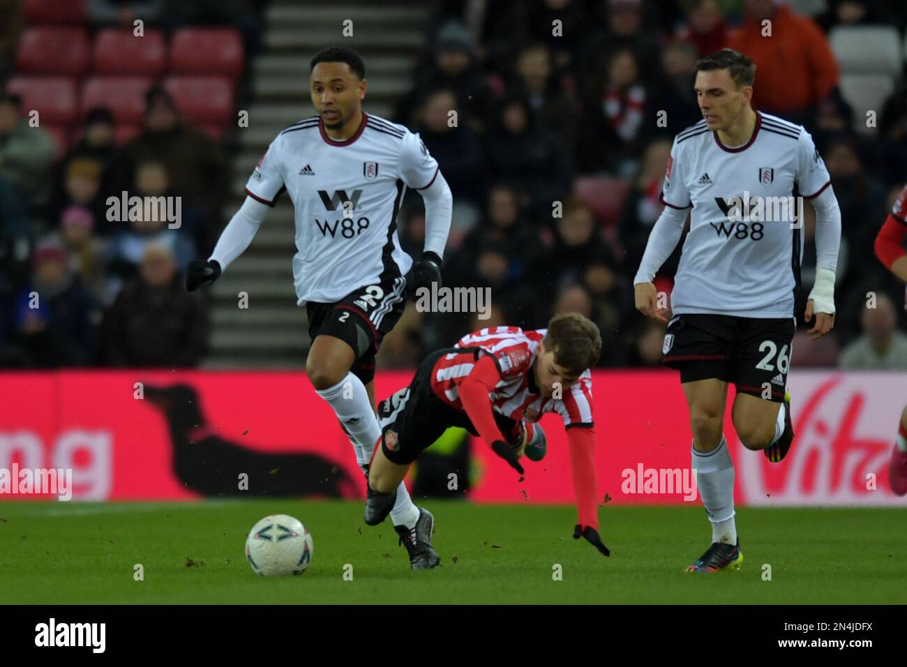 Sunderland, UK. 8th February 2023Sunderland's Edouard Michut is moulded by Fulham FC Kenny Tete during the FA Cup 4th Round Replay between Sunderland and Fulham at the Stadium Of Light, Sunderland on Wednesday 8th February 2023. (Photo: Scott Llewellyn | MI News) Credit: MI News & Sport /Alamy Live News Stock Photo
