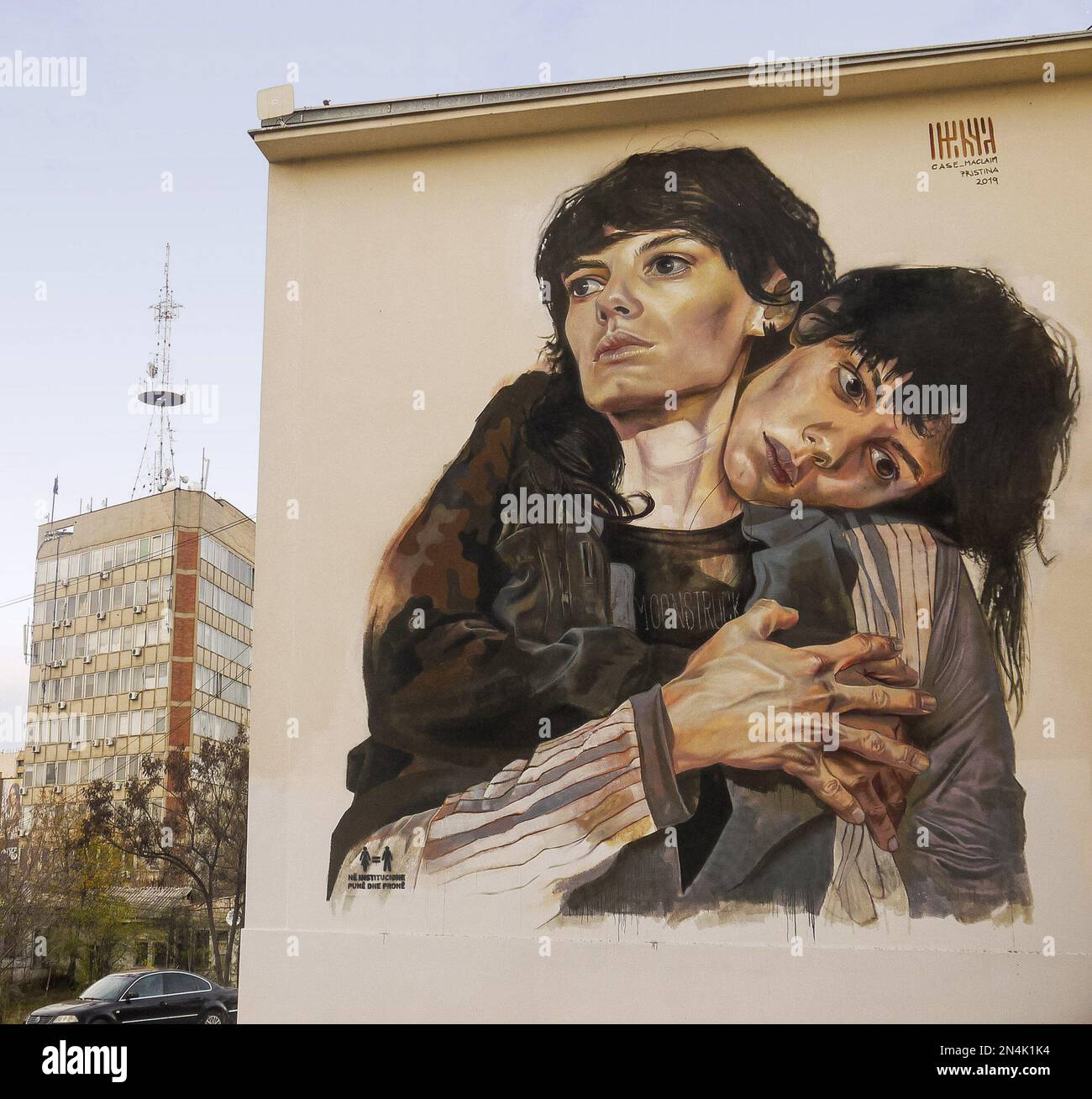 Mural of two women embracing by Case Maclaim (Andreas Chrzanowski), Pristina, Kosovo Stock Photo