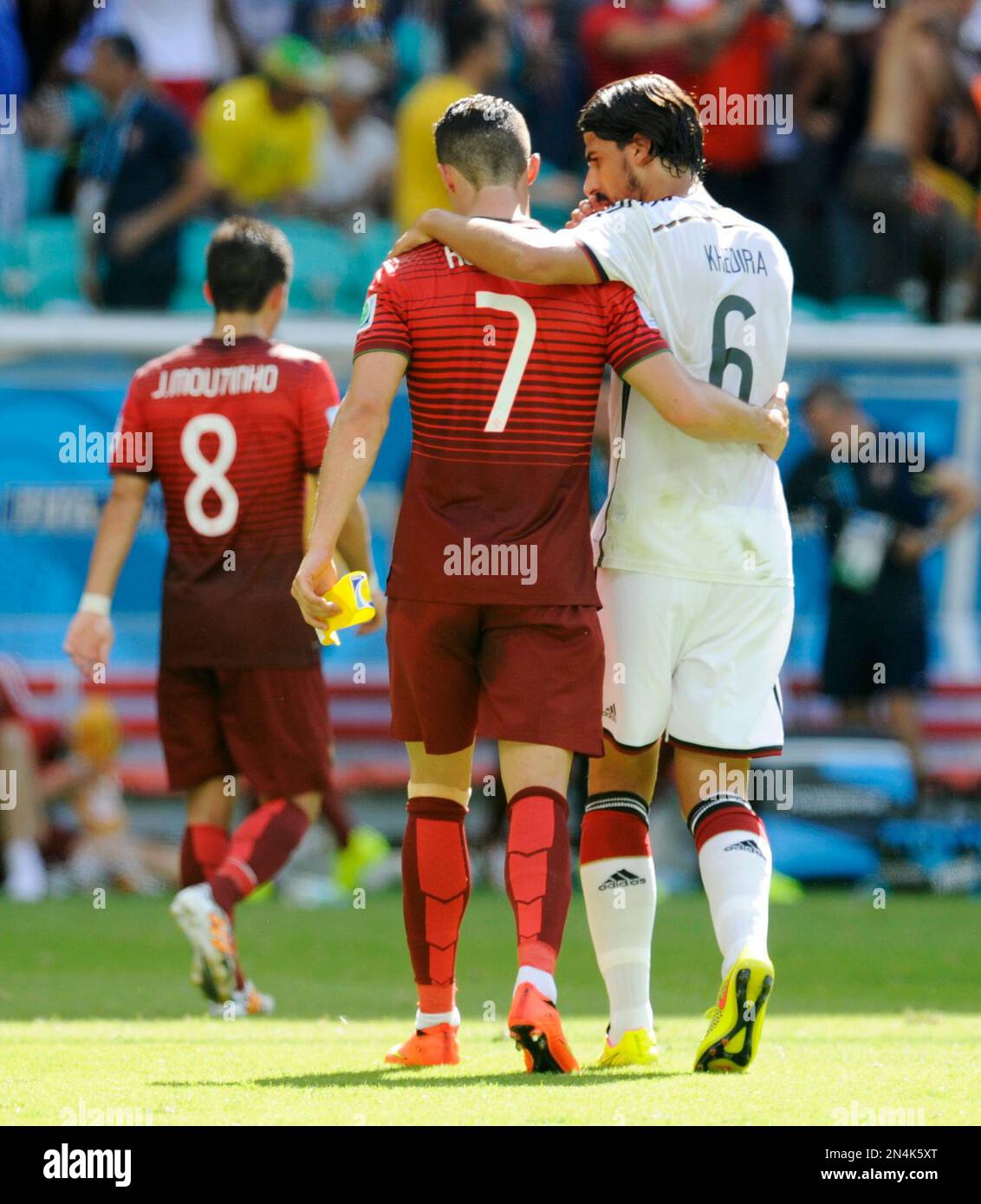 Portugal's Cristiano Ronaldo (7) walks off the pitch with Germany's Sami  Khedira (6) at the half during the group G World Cup soccer match between  Germany and Portugal at the Arena Fonte
