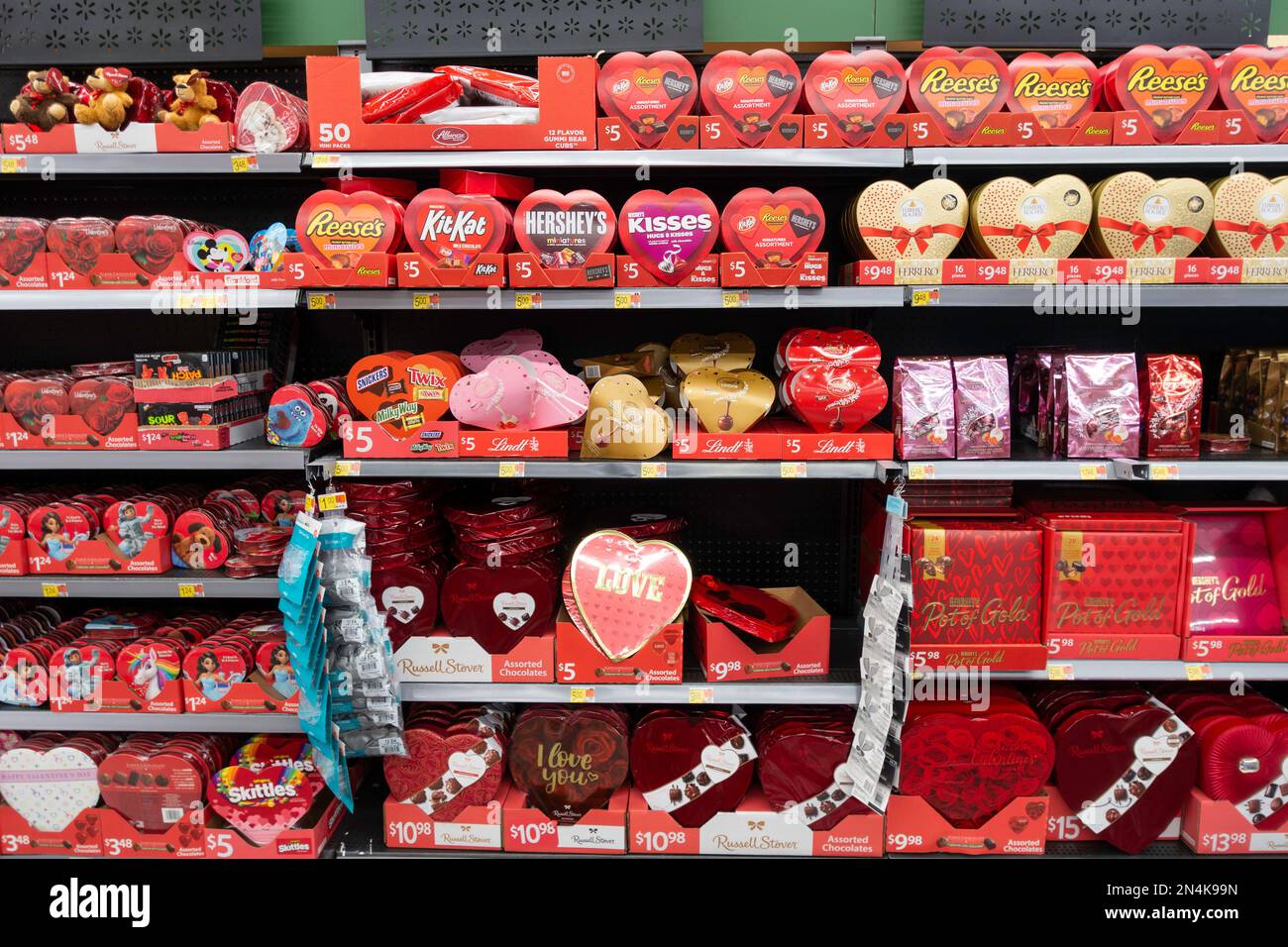 Store display of various brands of heartshaped boxes of chocolates for