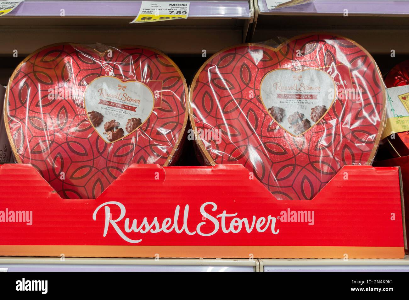 Store display of Russell Stover heart-shaped boxes of chocolates for Valentine's Day. USA. Stock Photo