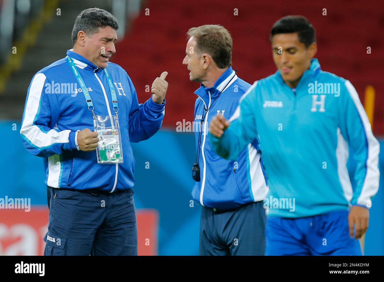 Luis Fernando Suarez, head coach of Honduras' soccer team, left, talks with an assistant during a training session at the Estadio Beira-Rio in Porto Alegre, Brazil, Saturday, June 14, 2014. Honduras will play in E group of the Brazil 2014 World Cup. (AP Photo/David Vincent) Stock Photo