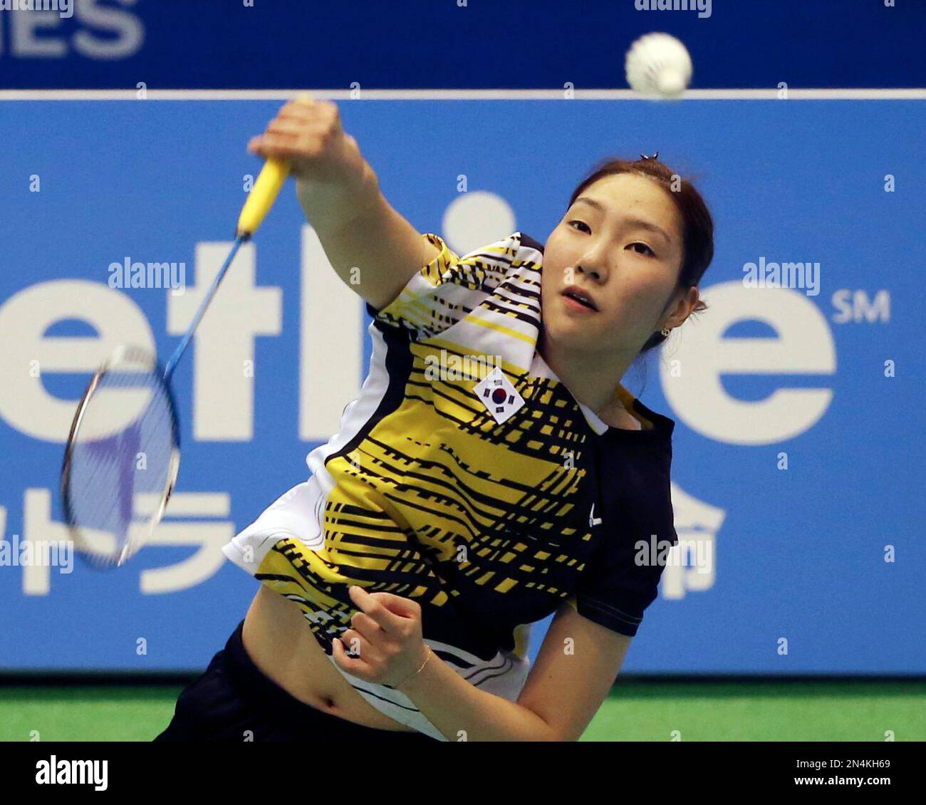 Sung Jihyun of South Korea returns a shot against China's Li Xuerui
