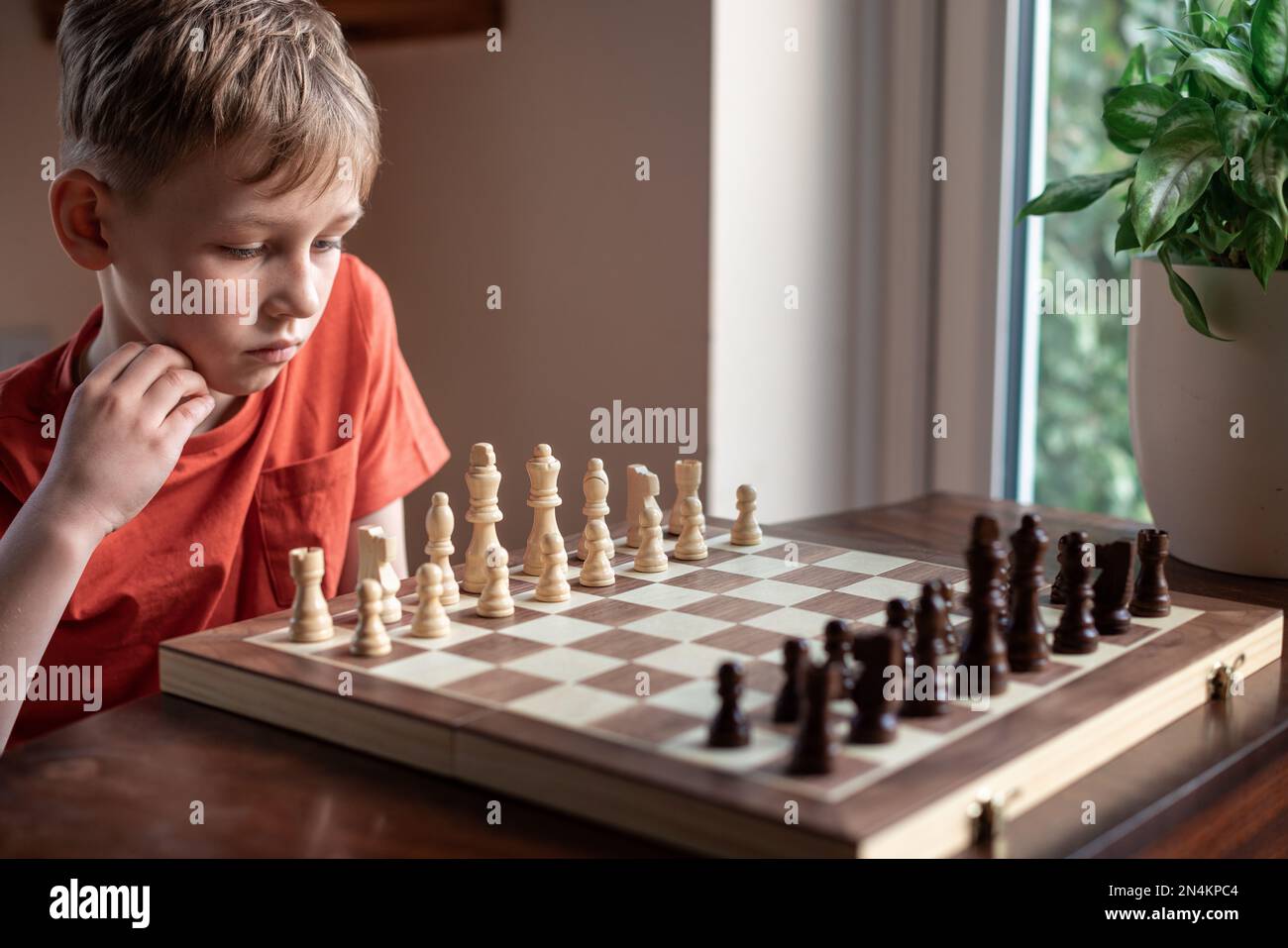 Blonde Caucasian Boy Thinking of a Next Chess Move Playing Chess. Strategy,  Planning Concept Stock Image - Image of queen, people: 207341503