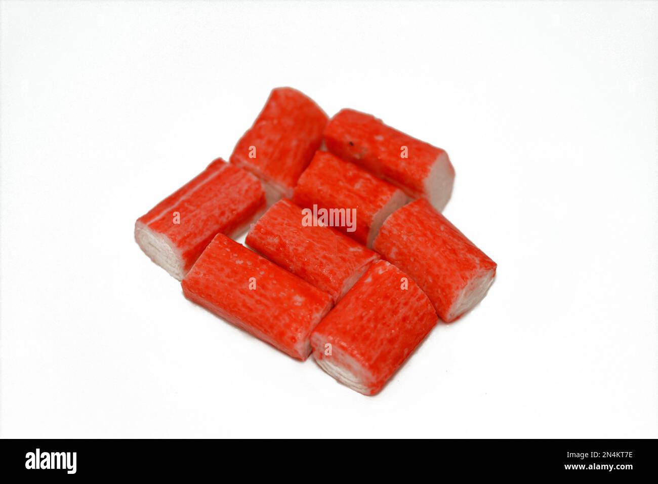 Fresh cut pieces of frozen crab sticks ready to be cooked in a seafood