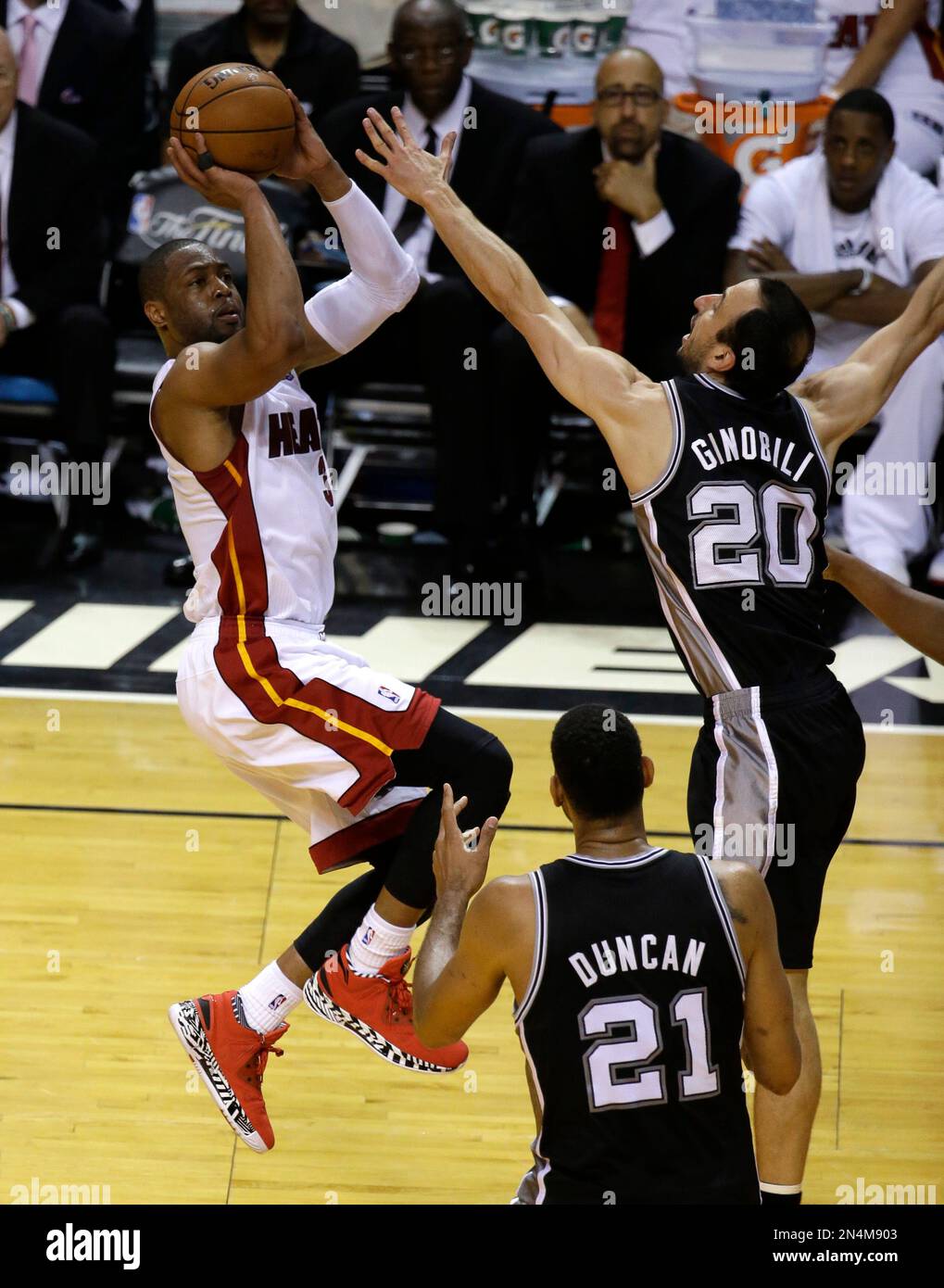 Miami Heat guard Dwyane Wade (3) goes up against San Antonio Spurs