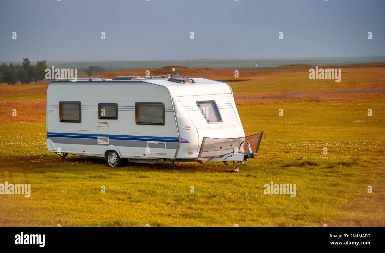 Roulotte on the countryside of Iceland, summer season, white caravan in autumn Stock Photo