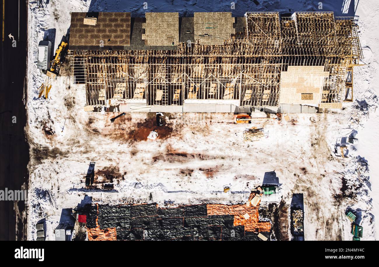Aerial drone view of a multifamily apartment complex under construction. Stock Photo