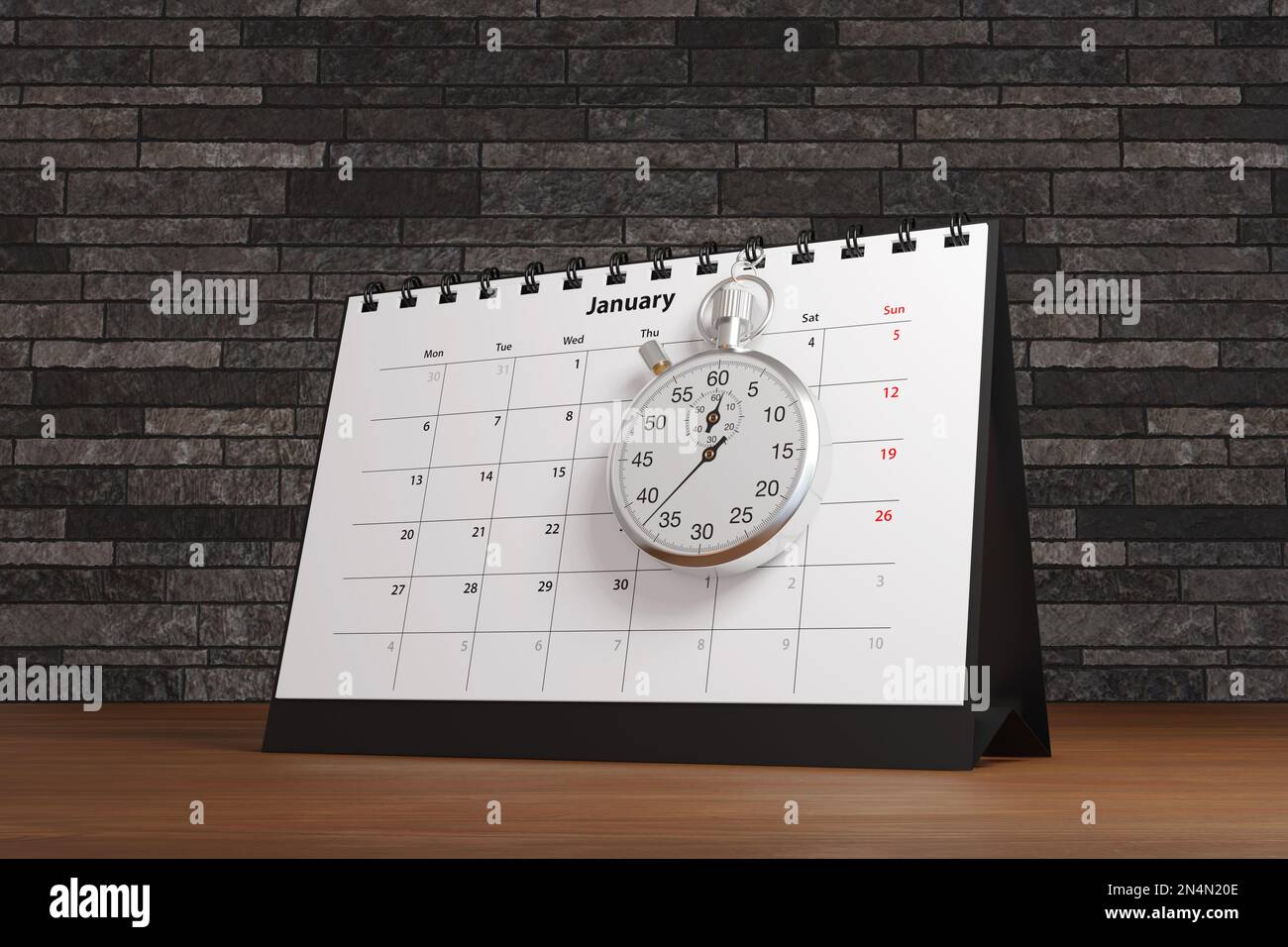 Stopwatch hung on a desktop calendar on an office wooden desk. Illustration of the concept of