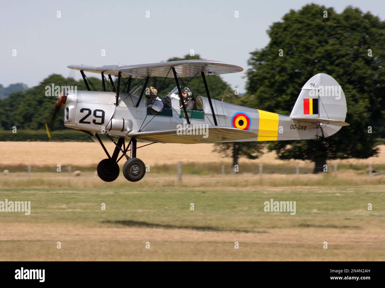 A Stampe and Vertongen SV-4 Belgian made biplane in action at Headcorn airfield Kent England Stock Photo