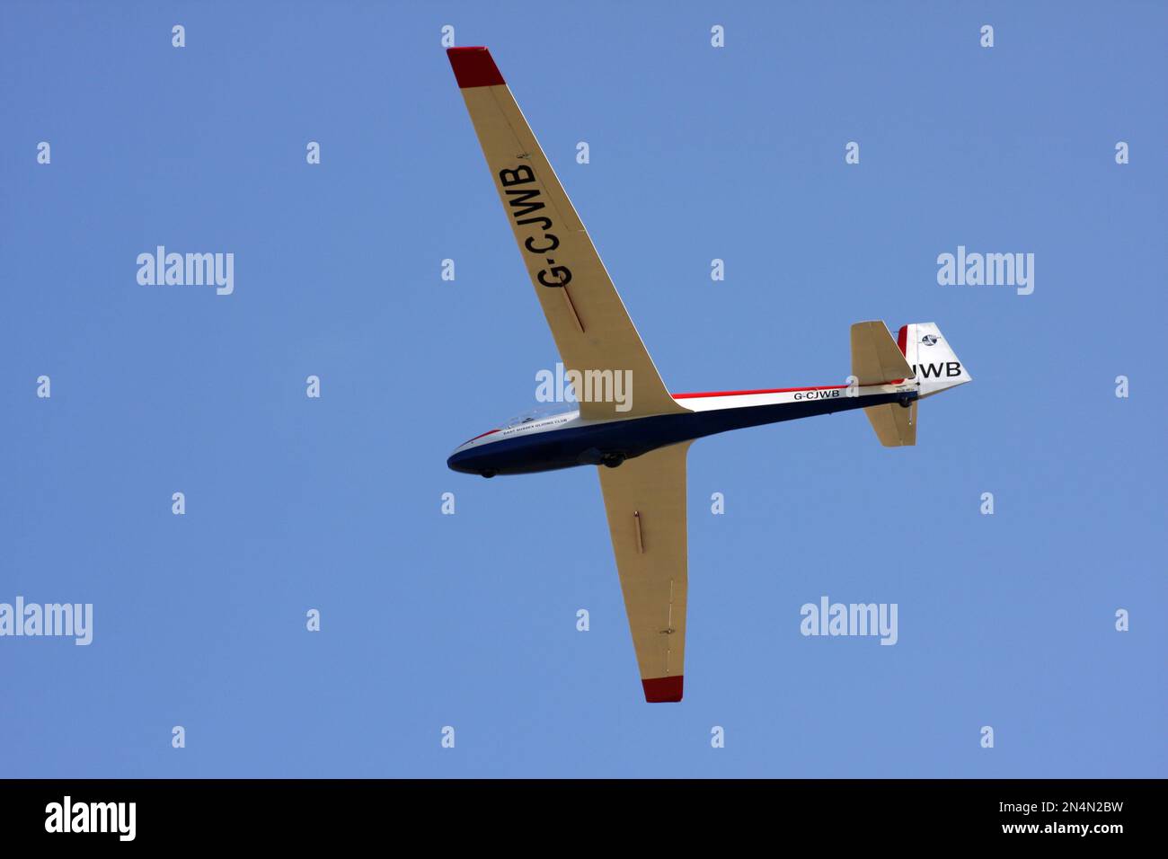 A Schleicher ASK13 glider of East Sussex Gliding Club flying at