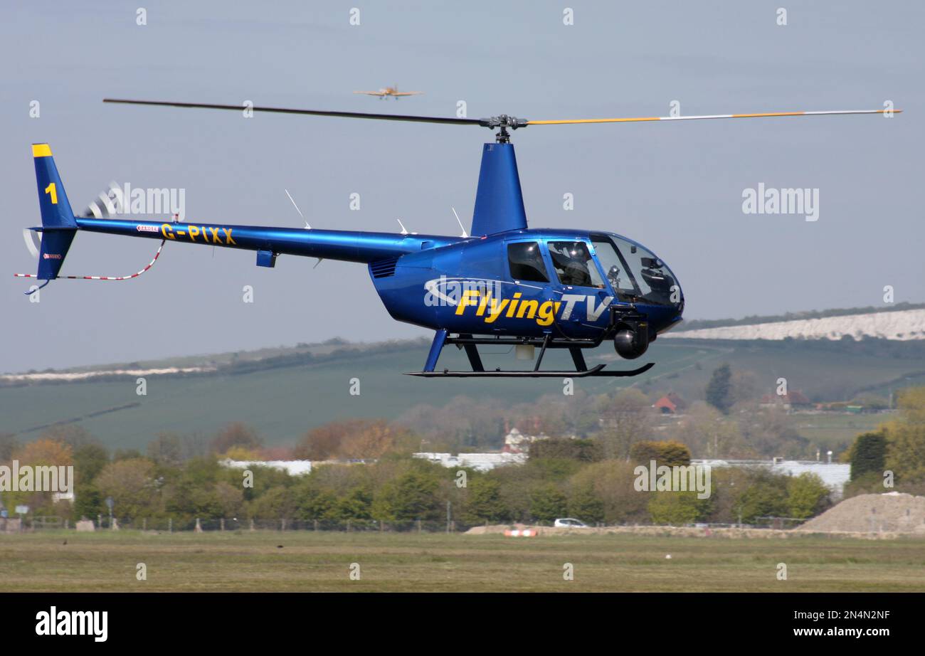 A Robinson R44 Raven II Newscopter of Flying TV arriving at Brighton ...