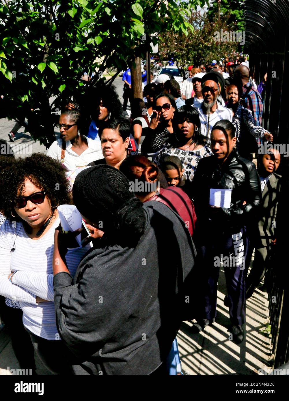 crowd-stand-in-a-line-stretching-a-block-at-the-funeral-for-prince