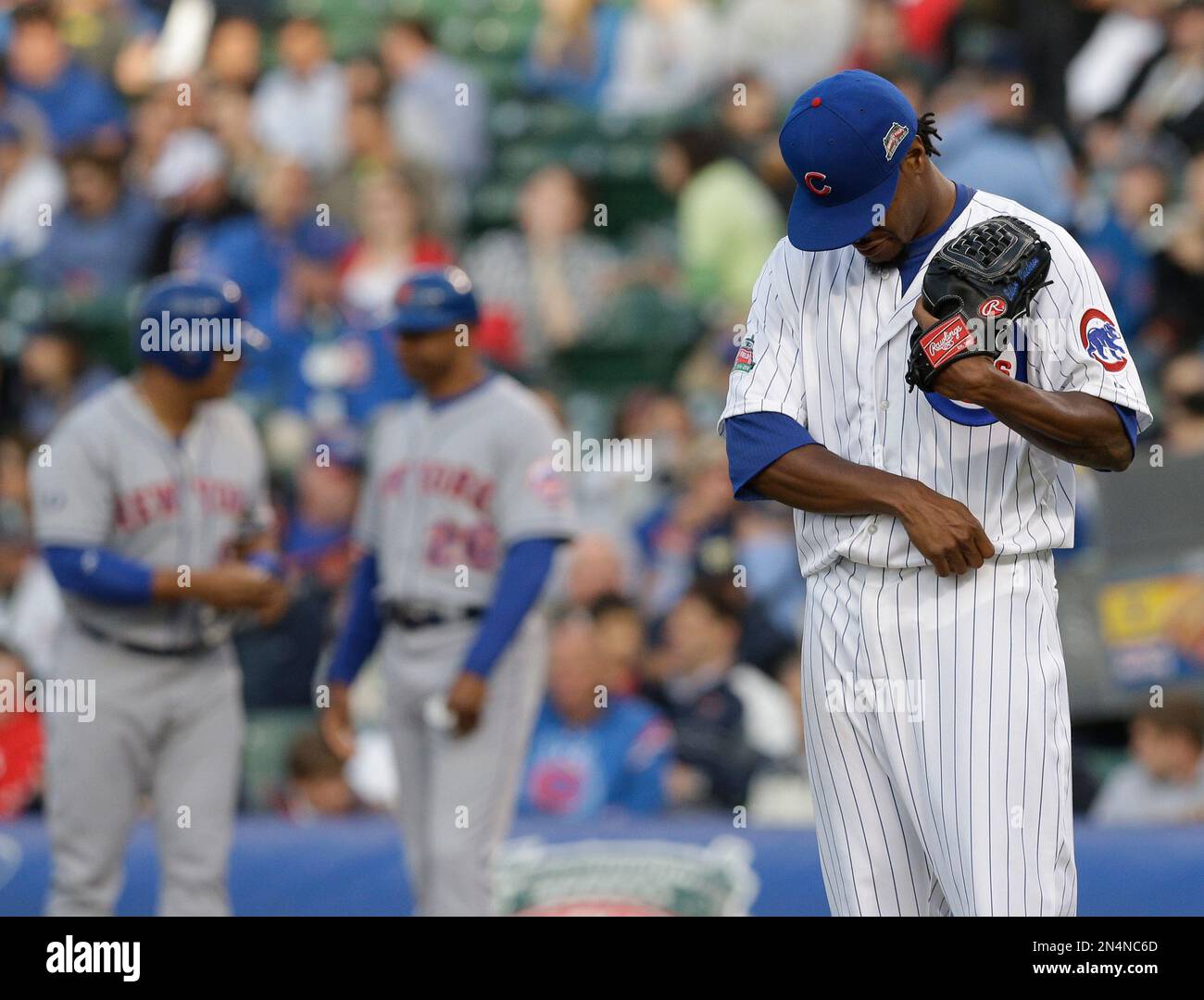 Chicago Cubs starter Edwin Jackson looks down during the first inning