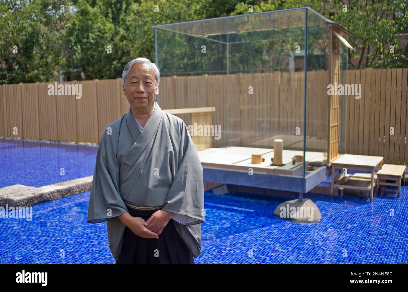 Japanese artist Hiroshi Sugimoto poses in front of his 'The Glass Tea