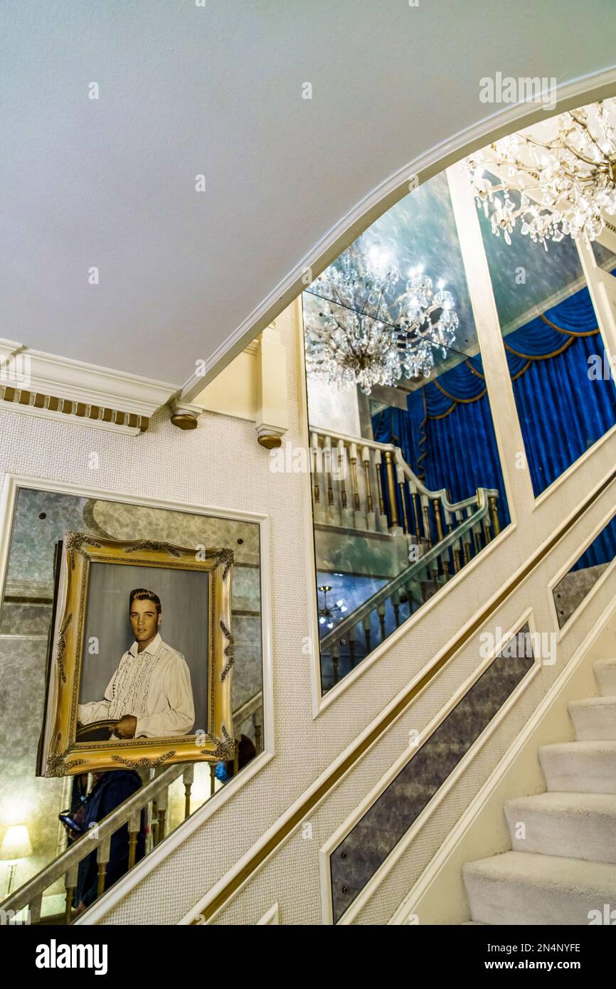 The main staircase with oil portrait of Elvis in Graceland, the home of Elvis Presley in Memphis, Tennessee. Stock Photo