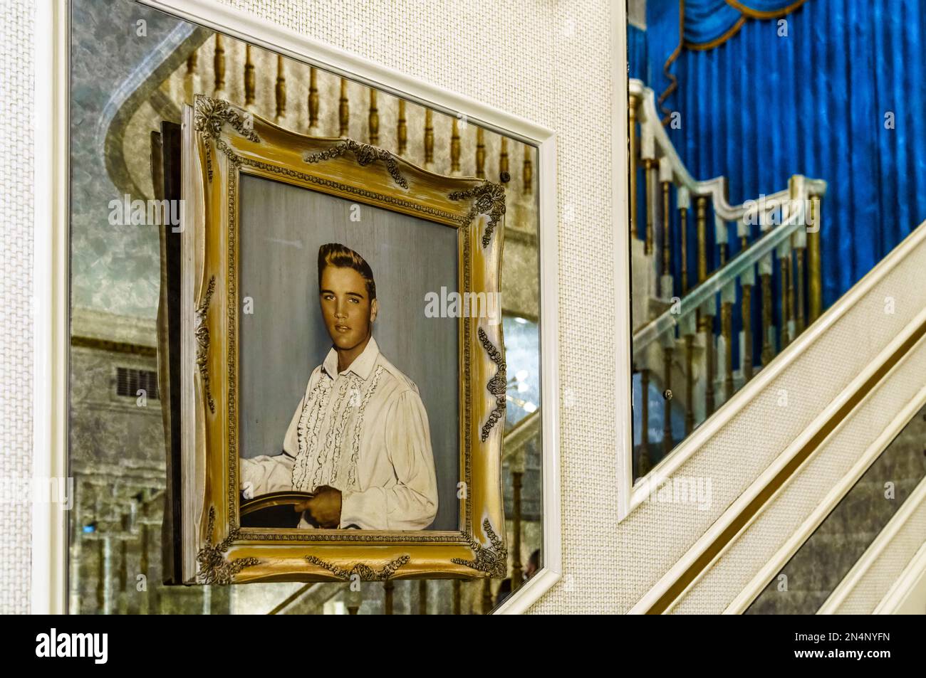 The oil portrait of Elvis Presley on the main staircase in Graceland, his home in Memphis, Tennessee. Stock Photo