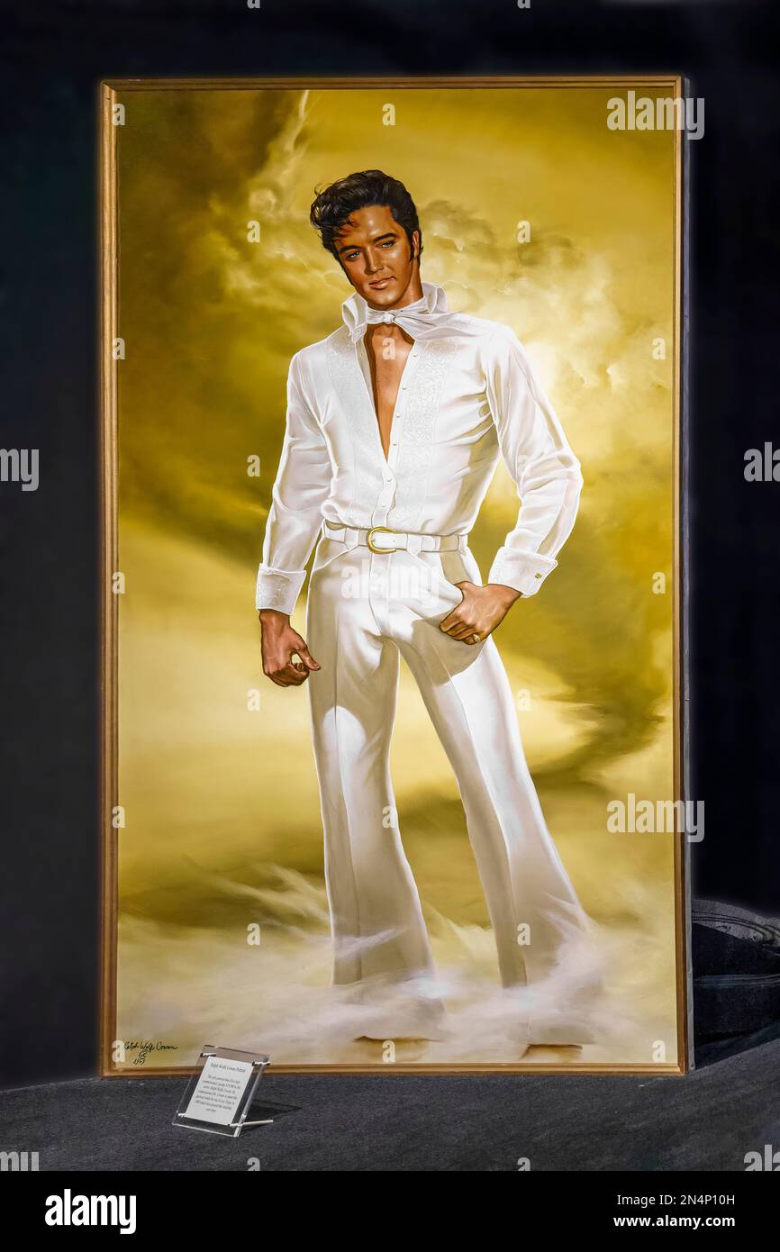 Full length portrait of Elvis Presley in the Trophy Building at Graceland, his home in Memphis, Tennessee. Stock Photo