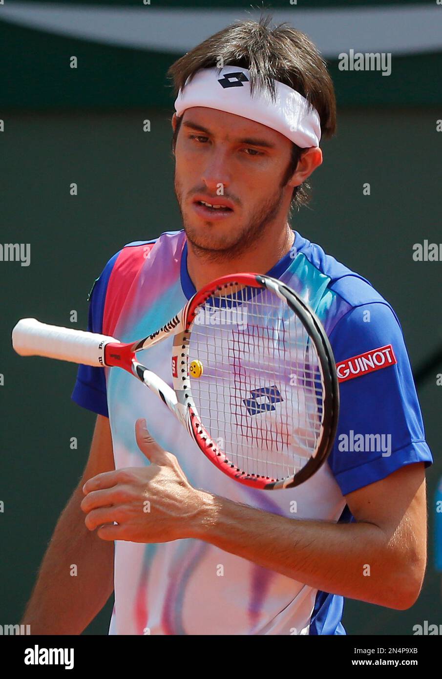 Argentina's Leonardo Mayer throws his racket as he plays Spain's Rafael