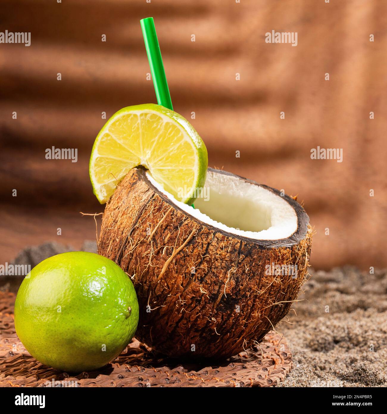 Refreshing coconut drink mixed with lime juice - Cocos nucifera Stock Photo