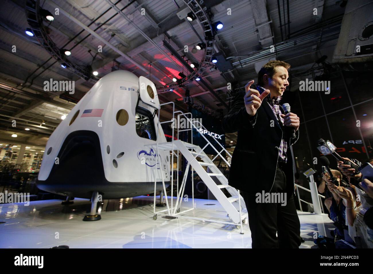 Elon Musk, CEO and CTO of SpaceX, answers questions from the media in